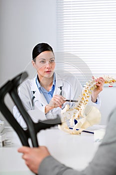 Orthopaedic surgeon explaining a back injury