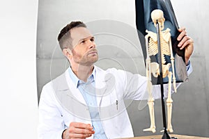 Orthopaedist. The doctor is watching an X-ray. photo