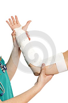 Orthopedic doctor visit patient with broken arm with brace. Human hands. Isolated on white.