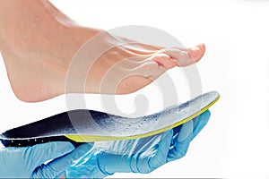 Orthopedic insole in the hands