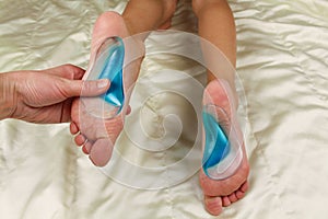 Orthopedic insoles for children`s feet.