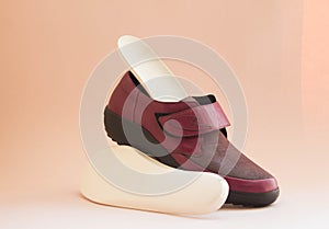 Orthopedic insoles with orthopedic shoes. Accessories for the prevention of foot problems