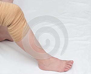 Orthopedic kneecap to relieve the load and fix the sore knee, close-up, copy space, medical, bandage