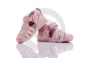 Orthopedic leather baby girl summer sandals isolated on white