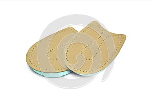 Orthopedic leather heel pad from corns for the correction of different lengths of legs isolated on white background. Leather