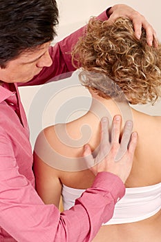 Orthopedic surgeon with a patient in treatment photo