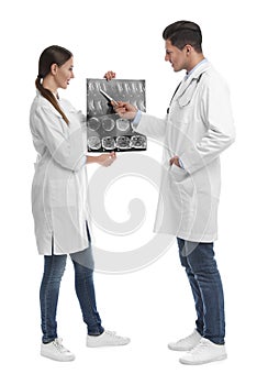 Orthopedists working with X-ray picture on background