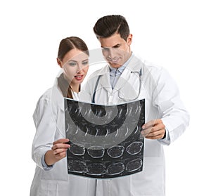 Orthopedists working with X-ray picture on background