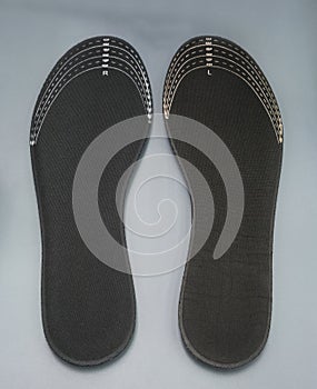 Orthotics on grey background. Insert in shoes to support