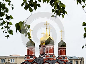 Ortodox church and birch twigs in Moscow city