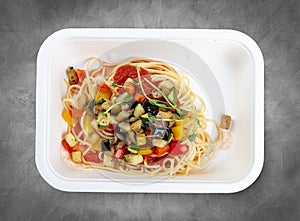 Ortolana pasta with vegetable sautÃ©. Healthy food. Takeaway food. Top view, on a gray background
