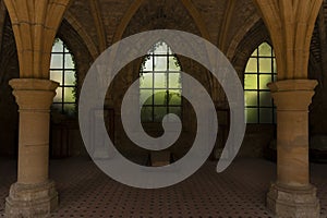 Orval Abbey, in Belgium. Ruins of the Cistercian monastery and the Gothic church. Indoors room with arches and vaults.