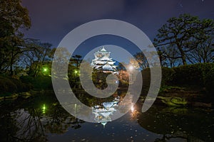 Osaka Castle with reflection in pond and night sky with star at Osaka Japan. Asia