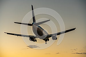 ANA Wings Boeing 737-500 landing at dusk