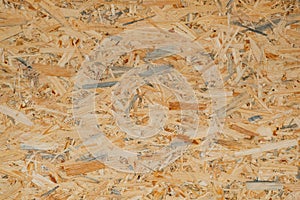 OSB pressed sawdust board,wood chips,wooden texture beckground,seamless surface