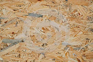 OSB pressed sawdust board,wood chips,wooden texture beckground,seamless surface