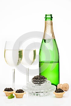 Osetra caviar and champagne isolated photo