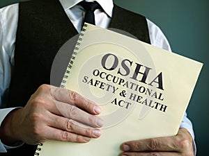 OSHA Occupational Safety & Health Act in the hand