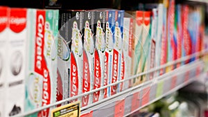 Toothbrushes and toothpaste are on the shelves of stores.