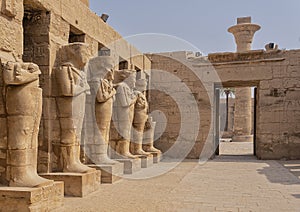 Osiride sculptures of King Ramesses III in the courtyard of his temple in the Karnak temple complex near Luxor, Egypt.