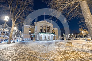 Oslo national theater during winter night time in february. Beautiful vintage building in oslo downtown, on a cold night. Snow and photo