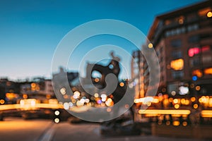 Oslo, Norway. Night Abstract Boke Bokeh Background Effect. Horse Statue On The Street And Residential Multi-storey