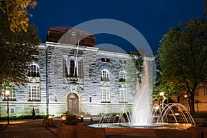 Oslo, Norway. Night View Of Old Bank Building And Fountain In Bank Square photo