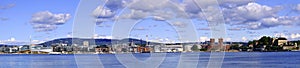 Oslo, Norway - Panoramic view of Oslo waterfront with Akershus Fortress, City Hall and Aker Brygge borough at Pipervika harbor