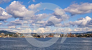 Oslo, Norway - Panoramic view of Oslo waterfront with Akershus Fortress, City Hall and Aker Brygge borough at Pipervika harbor