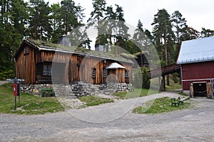 Oslo, Norway, September 2022: Old wooden house with grass roof exhibited at The Norwegian Museum of Cultural History