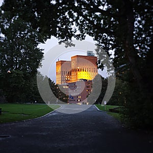 Oslo Town Hall, Norway in the evening. Bell Tower. Trees. Evening.