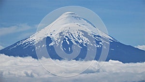 Osorno Volcano over the clouds