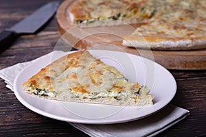 Ossetian pie with cheese and herbs dill, parsley, scallion.
