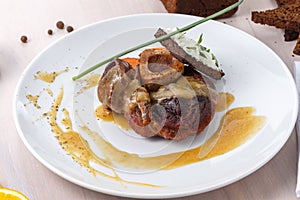 Osso buco with citrus sauce on plate