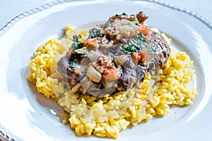 Osso Buco, Veal Shanks that are Braised in Wine with Milanese Saffron Risotto photo