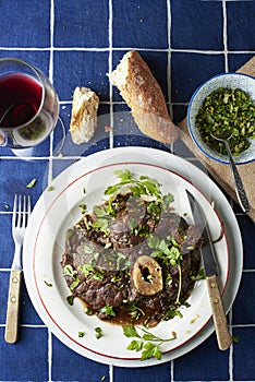 Ossobuco alla Milanese dressed with gremolata.