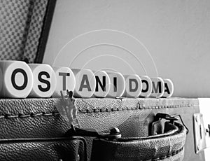 Ostani doma, old luggage and miniature man photo