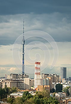 Ostankino Tower above Moscow cityscape in summer, Russia. Panorama of Moscow and TV tower on blue sky background. Moscow