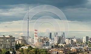 Ostankino Tower above Moscow cityscape in summer, Russia. Panorama of Moscow and TV tower on blue sky background. Moscow