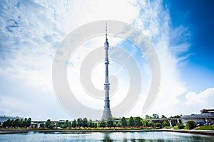 Ostankino tower on blue sky and pond in front