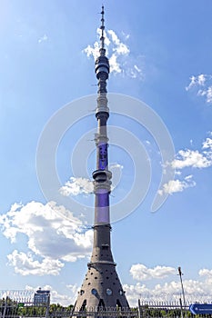 Ostankino TV tower on a background of blue sky with clouds