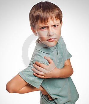 Osteochondrosis kid teenage boy isolatd holds his