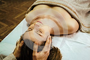 An osteopathic doctor conducts physiological and emotional therapy for a woman 8