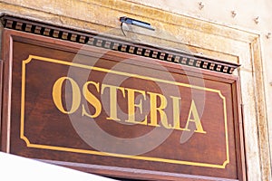 Osteria sign in sunlight photo