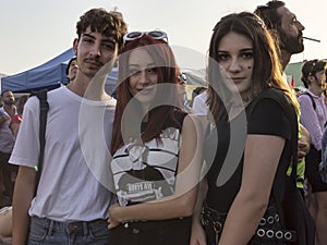 Three friends pose for the camera on the Lazio pride day event in Rome