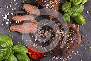 Ostrich steak over wooden background