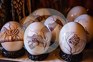 Ostridge\'s eggs with artistic decorative drawing of African motives, home decoration made in Africa