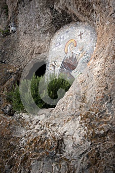 OSTROG, Montenegro: Cave and icon of Saint Venerable Isaiah Onogosha in rocky Serbian Orthodox Christian monastery Ostrog in mount