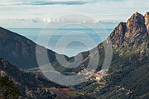 Ota in Corsica with mountains and Mediterranean sea