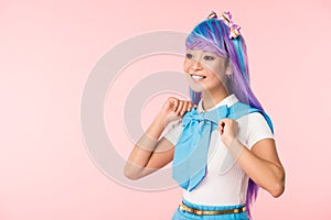 Otaku girl in purple wig looking away isolated on pink